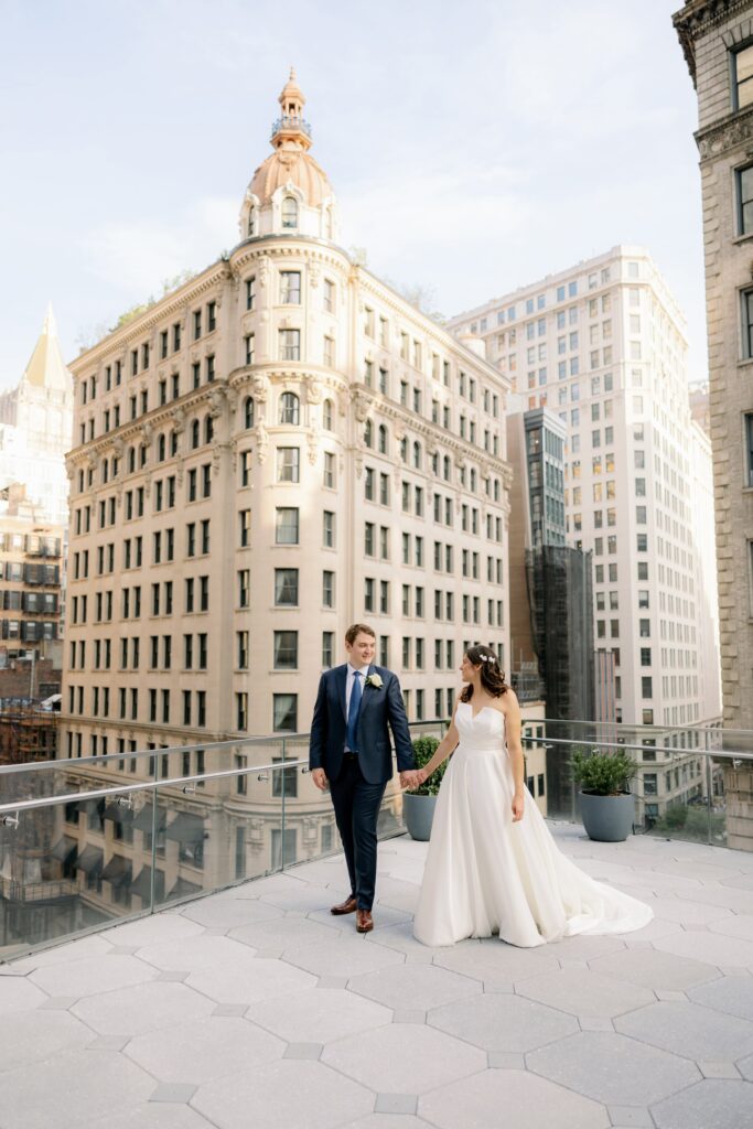 Bride and groom embrace at Madison Bar in Ritz Carlton Nomad, NYC.